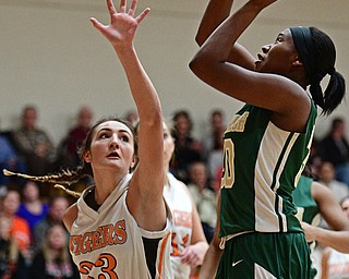 NEWTON FALLS, OHIO - FEBRUARY 13, 2017: Anyah Curd #30 of Newton Falls puts up a shot over Isabelle Kline #33 of Newton Falls during the second half of their game Monday night at Newton Falls High School. DAVID DERMER | THE VINDICATOR