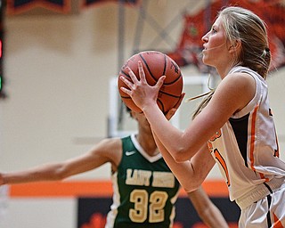 NEWTON FALLS, OHIO - FEBRUARY 13, 2017: Ashley Sembach #11 of Newton Falls puts up a shot while Simone Curd #32 of Ursuline runs over to apply late pressure during the second half of their game Monday night at Newton Falls High School. DAVID DERMER | THE VINDICATOR