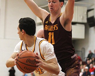 Dan Ritter(11) of South Range tries to block out Luke PecchiaSP????(44) of Mooney's shot during the first quarter as South Range High School takes on Cardinal Mooney High School at the Cardinal Mooney High School Gymnasium in Youngstown on Tuesday, Feb. 14, 2017.  South Range won 65-43..(Nikos Frazier | The Vindicator)..