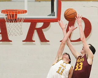 Anthony Ritter(33) of South Range and Anthony Fire(11) of Mooney fight for the rebound during the third quarter as South Range High School takes on Cardinal Mooney High School at the Cardinal Mooney High School Gymnasium in Youngstown on Tuesday, Feb. 14, 2017.  South Range won 65-43..(Nikos Frazier | The Vindicator)..