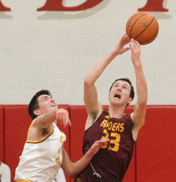 Anthony Ritter(33) of South Range and Anthony Fire(11) of Mooney fight for the rebound during the third quarter as South Range High School takes on Cardinal Mooney High School at the Cardinal Mooney High School Gymnasium in Youngstown on Tuesday, Feb. 14, 2017.  South Range won 65-43..(Nikos Frazier | The Vindicator)..