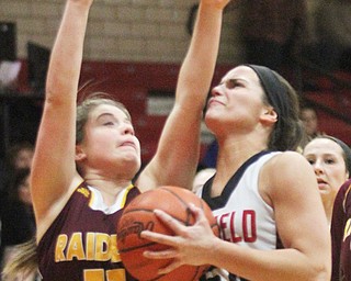 William D. Lewis The Vindicator Canfield's Serena Sammarone(54) collides with South Range's Bri Modic(11) during Feb 15, 2017 action in Canfield.