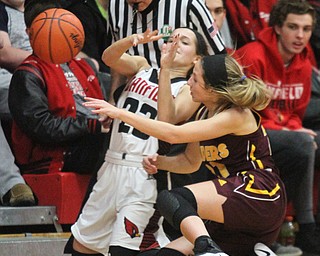 William D. Lewis The Vindicator Canfield's Ashley Veneroso(23) and South Range's Samantha Patrone (21) go for a loose ball during Feb 15, 2017 action in Canfield.