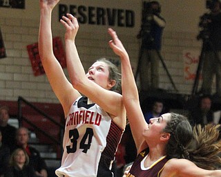 William D. Lewis The Vindicator Canfield's Brittany Coonce(34) shoots over  South Range's Taylor Naples(23) during Feb 15, 2017 action in Canfield.