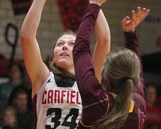 William D. Lewis The Vindicator Canfield's Brittany Coonce(34) shoots over  South Range's Madison durkin (13) during Feb 15, 2017 action in Canfield.