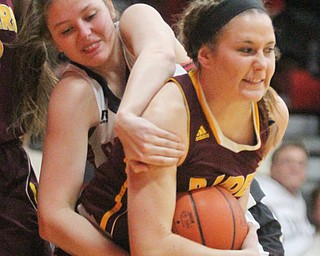William D. Lewis The Vindicator Canfield's Brittany Coonce(34) and South Range's Kate Yeagley(3) fight for the ball during Feb 15, 2017 action in Canfield.