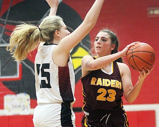 William D. Lewis The Vindicator South Range's Taylor Naples(23)passes around Canfield's Mia Cayavec(25) during Feb 15, 2017 action in Canfield.