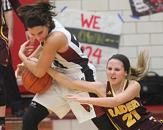 William D. Lewis The Vindicator Canfield's Serena Sammarone(54) and South Range'sSamantha Patrone (21) fight for a loose ball during Feb 15, 2017 action in Canfield.
