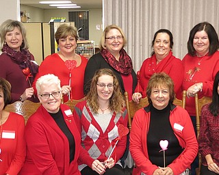 SPECIAL TO THE VINDICATOR
Austintown Junior Women’s League members wore red at their February meeting to support American Heart Association’s “Healthy Heart” campaign. In front from left, are Kathy Rusback, president; Sandy Gaskill; Jessica Munger; Sue Hovanec; and Brittany Bueno. In back are Janice Simmerman, recording secretary; Linda Jones, first vice president; Eileen Frost, secretary; Colleen Miller; MaryAnn Herschel; Peggy Bennett; and Ruty Rodriguez-Patterson. The Rev. Ron Mauch, associate pastor of Emmanuel Community Church, spoke about mission trips to El Salvador. Below are his wife Joann, left, his son Ed, and Rev. Mauch. Foods from El Salvador were served. Information and photos can be found on the league’s Facebook page. 