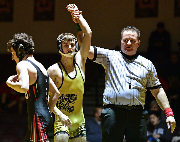 LIBERTY, OHIO - FEBRUARY 15, 2017: Jordan McFadden of Liberty has his arm raised after pinning Nick Dibble in their 106lb bout Wednesday night at Liberty High School. DAVID DERMER | THE VINDICATOR