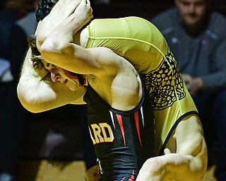 LIBERTY, OHIO - FEBRUARY 15, 2017: Dakota McCluskey of Girard controls the body of Ben Sattler of Liberty while he rides his back during their 120lb bout Wednesday night at Liberty High School. DAVID DERMER | THE VINDICATOR