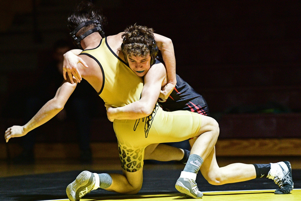 LIBERTY, OHIO - FEBRUARY 15, 2017: Matt Belcik of Girard takes Hamad Alhmeed of Liberty down to the mat during their 126lb bout during their 120lb bout Wednesday night at Liberty High School. DAVID DERMER | THE VINDICATOR