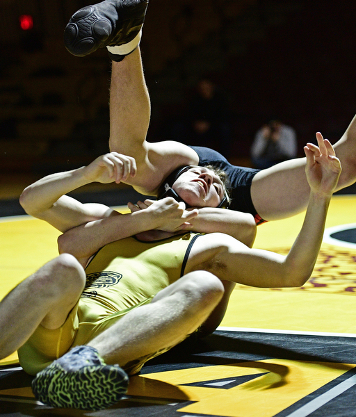 LIBERTY, OHIO - FEBRUARY 15, 2017: James Mortimer of Liberty thinks of his next move while being flipped by Shawn Thomas of Girard during their 132lb bout Wednesday night at Liberty High School. DAVID DERMER | THE VINDICATOR