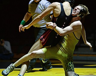 LIBERTY, OHIO - FEBRUARY 15, 2017: James Mortimer of Liberty attempts to drag Shawn Thomas of Girard down to the mat during their 132lb bout Wednesday night at Liberty High School. DAVID DERMER | THE VINDICATOR