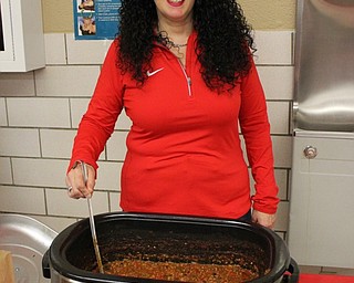 Neighbors | Submitted.Dana Zarlenga-Buist, fourth-grade teacher at C.H. Campbell Elementary School, served up her hot and spicy chili at the Inaugural Cardinal Chili Cook-off on Jan. 6.