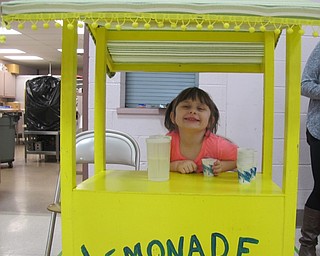 Neighbors | Alexis Bartolomucci.Allyson Dunn sat at the lemonade stand during the St. Jude Trike-A-Thon at The Growing Place on Jan. 31.