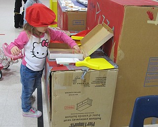 Neighbors | Alexis Bartolomucci.One of the children at The Growing Place St. Jude Trike-A-Thon on Jan. 31 wore a pizza shop hat and passed out pizza.
