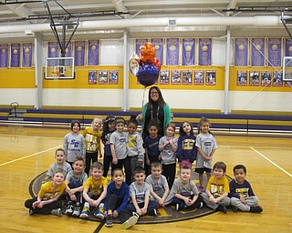 Neighbors | Alexis Bartolomucci.Amy Savich stood with her kindergarten class at St. Christine School on Jan. 26 after winning the Dunkin' Donuts Class Act teacher award from WFMJ.