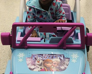 Neighbors | Abby Slanker.London Macklin, daughter of Donnell Macklin, got comfortable in her new “Frozen” Jeep, which was modified for her by Team London at the Go Baby Go build at the Mahoning County Career and Technical Center on Jan. 21.