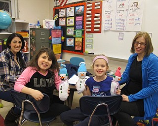 Neighbors | Alexis Bartolomucci.First-grade students at Poland Union worked on making snowman crafts during the Family Health Night on Jan. 25. Picture are, from left, Becky Dutton, Gianna Dutton, Anna Hardman and Rachael Hardman.