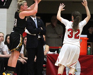 Northern Kentucky freshman guard Taryn Taugher(11) goes up for three as Youngstown State senior guard Jenna Hirsch(32) tries to block the shot during the 1st quarter as Northern Kentucky University takes on Youngstown State University, Thursday, Feb. 16, 2017 at the Beeghly Center at Youngstown State University. YSU won 77-73...(Nikos Frazier | The Vindicator)..