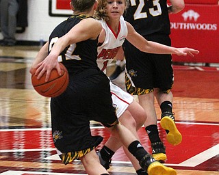 Northern Kentucky senior guard Kelley Wiegman(22) with the cross over to shake Youngstown State sophomore guard Melinda Trimmer(14) during the 5th quarter as Northern Kentucky University takes on Youngstown State University, Thursday, Feb. 16, 2017 at the Beeghly Center at Youngstown State University. YSU won 77-73...(Nikos Frazier | The Vindicator)..