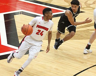 Youngstown State Penguins junior guard Cameron Morse(24) looks for a path to the basket during the 1st half as Wright State University takes on Youngstown State University, Thursday, Feb. 16, 2017 at the Beeghly Center at Youngstown State University. Wright State won 84-81...(Nikos Frazier | The Vindicator)..