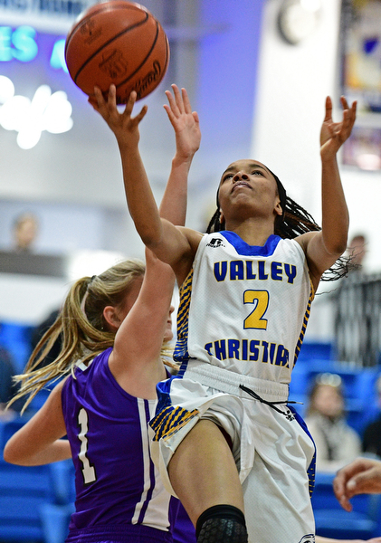 YOUNGSTOWN, OHIO - FEBRUARY 16, 2017: India Snyder #2 of Valley Christian goes to the basket after getting around Hannah Rossi #1 of Heartland during the first half of their game Thursday night at Valley Christian High School. DAVID DERMER | THE VINDICATOR