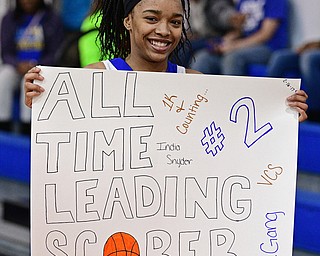 YOUNGSTOWN, OHIO - FEBRUARY 16, 2017: India Snyder #2 of Valley Christian holds up a poster made by her teammates as she celebrates her 1,000th career point after Wednesday night's game against Cleveland Central Catholic, on Thursday, Feb. 16, 2017. DAVID DERMER | THE VINDICATOR