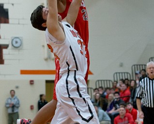 MICHAEL G TAYLOR | THE VINDICATOR- 02-17-17  -Basketball-  2nd qtr., Labrae's #21 Tyler Stephens scores over Howland's #33 Kevin Moamis.  Boys high School basketball Labrae Vikings vs Howland Tigers at Howland High School, Warren, OH