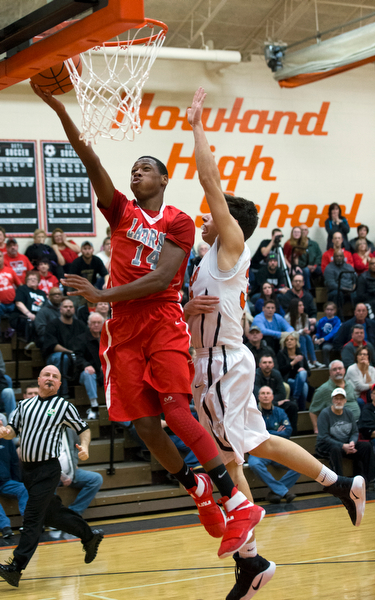 MICHAEL G TAYLOR | THE VINDICATOR- 02-17-17  -Basketball-  2nd qtr., Labrae's #14 Tariq Drake scores against Howland's #33 Kevin Moamis.  Boys high School basketball Labrae Vikings vs Howland Tigers at Howland High School, Warren, OH