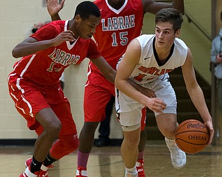 MICHAEL G TAYLOR | THE VINDICATOR- 02-17-17  -Basketball-  3rd qtr., Labrae's #14 Tariq Drake and  Labrae's #15 Carlton Brown trap Howland's #12 Michael Massucci. Boys high School basketball Labrae Vikings vs Howland Tigers at Howland High School, Warren, OH