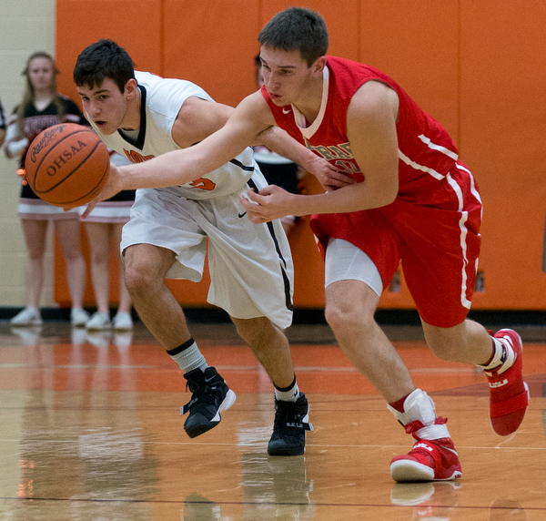 MICHAEL G TAYLOR | THE VINDICATOR- 02-17-17  -Basketball-  3rd qtr., Labrae's #10 Logan Kiser steals the ball from Howland's #33 Kevin Moamis.  Boys high School basketball Labrae Vikings vs Howland Tigers at Howland High School, Warren, OH
