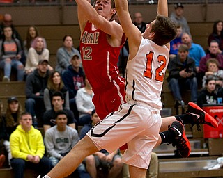 MICHAEL G TAYLOR | THE VINDICATOR- 02-17-17  -Basketball-  3rd qtr., Labrae's #12 Andrew Hankins shoots over Howland's #12 Michael Massucci. Boys high School basketball Labrae Vikings vs Howland Tigers at Howland High School, Warren, OH