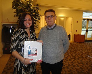 SPECIAL TO THE VINDICATOR
Melissa Ames, vice president of Better Business Bureau, left, and Doug Wilcox recently organized a program for Friends of Austintown Library. Ames presented the program “Fraud, Scams and How to be a Better Consumer.”