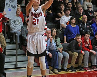 Canfield's Zach Tinkey (21) attempts a 3-pointer during Friday nights matchup against Poland at Canfield High School.  Dustin Livesay  |  The Vindicator  2/17/17 Canfield High School.
