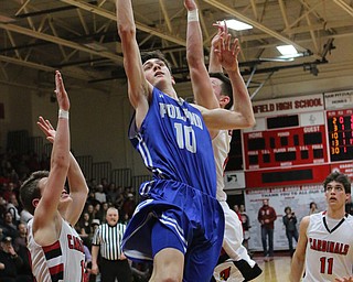 Poland's Daniel Kramer (10) puts up a shot while being double teamed by Canfield defenders during Friday nights matchup at Canfield High School.  Dustin Livesay  |  The Vindicator  2/17/17 Canfield High School.