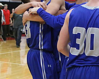 Poland's Braeden O'Shaungnessey (spell ok) (3) hugs teammate Brandon Barringer (13) after the Bulldogs defeated Canfield in the Batte of 224 on Friday night.  Dustin Livesay  |  The Vindicator  2/17/17 Canfield High School.
