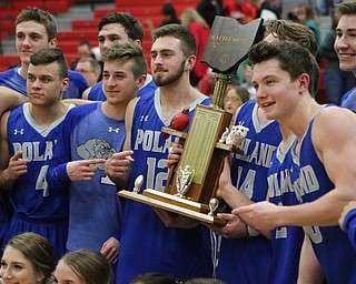 Members of the Poland Bulldog basketball team hold the "Battle of 224" trophy after defeating Canfield on Friday night.  Dustin Livesay  |  The Vindicator  2/17/17 Canfield High School.