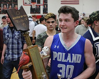 Poland's Kyle Patterson (30) holds the "Battke of 224" trophy after defeating Canfield on Friday night.  Dustin Livesay  |  The Vindicator  2/17/17 Canfield High School.