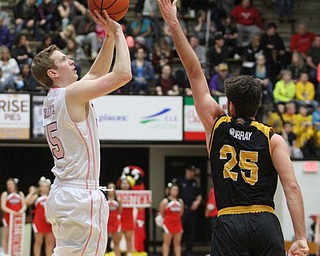 Youngstown State Penguins senior guard Brett Frantz(15) goes up for three as Northern Kentucky senior guard Cole Murray(25) tries to block his shot during the 1st half as Northern Kentucky takes on Youngstown State, Saturday, Feb. 18, 2017 at the Beeghly Center. Youngstown State won, 81-77...(Nikos Frazier | The Vindicator)..