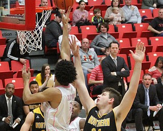 Youngstown State Penguins sophomore forward Devin Haygood(2) goes up for a layup as Northern Kentucky sophomore forward Drew McDonald(34) tries to stop the ball during the 1st half as Northern Kentucky takes on Youngstown State, Saturday, Feb. 18, 2017 at the Beeghly Center. Youngstown State won, 81-77...(Nikos Frazier | The Vindicator)..