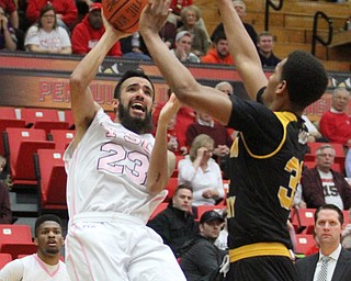 Youngstown State Penguins junior guard Francisco Santiago(23) tries to save his shot as he falls down during the 1st half as Northern Kentucky takes on Youngstown State, Saturday, Feb. 18, 2017 at the Beeghly Center. Youngstown State won, 81-77...(Nikos Frazier | The Vindicator)..