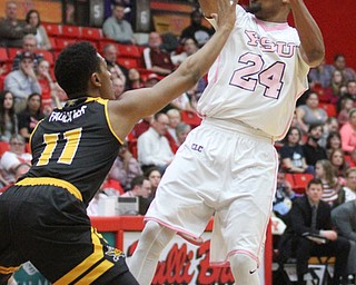 Youngstown State Penguins junior guard Cameron Morse(24) passes the ball as Northern Kentucky freshman guard Mason Faulkner(11) tries to snag the ball during the 1st half as Northern Kentucky takes on Youngstown State, Saturday, Feb. 18, 2017 at the Beeghly Center. Youngstown State won, 81-77...(Nikos Frazier | The Vindicator)..