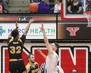 Northern Kentucky freshman guard Dantez Walton(32) goes up for three as Youngstown State Penguins senior forward Matt Donlan(0) tries to stop the shot during the 1st half as Northern Kentucky takes on Youngstown State, Saturday, Feb. 18, 2017 at the Beeghly Center. Youngstown State won, 81-77...(Nikos Frazier | The Vindicator)..