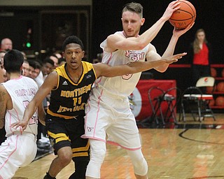 Youngstown State Penguins senior forward Matt Donlan(0) and Youngstown State Penguins junior guard Francisco Santiago(23) try to keep the penguins ball from Northern Kentucky freshman guard Mason Faulkner(11) during the 1st half as Northern Kentucky takes on Youngstown State, Saturday, Feb. 18, 2017 at the Beeghly Center. Youngstown State won, 81-77...(Nikos Frazier | The Vindicator)..