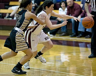 MICHAEL G TAYLOR | THE VINDICATOR- 02-18-17  -Basketball-  2nd qtr., as they go for the ball,  Boardman's #14 Lauren Pavlansky is fouled by Harding's #12 Ka'Rina Mallory.  Lady Basketball- Warren G. Harding Raiders vs Boardman Spartans at Boardman High School in Boardman, OH.