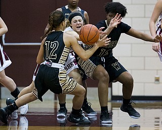 MICHAEL G TAYLOR | THE VINDICATOR- 02-18-17  -Basketball-  4th qtr., Boardman's #13 Cate Green (middle) causes a turnover and reaches for the loose ball between Harding's #12 Ka'Rina Mallory and Harding's #13 Chardonnay Burke.  Lady Basketball- Warren G. Harding Raiders vs Boardman Spartans at Boardman High School in Boardman, OH.