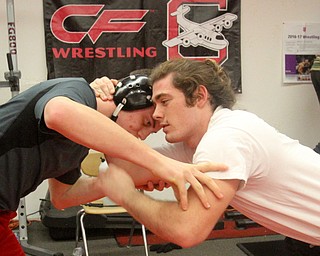William D Lewis The vindicator Columbiana wrestlers Nathan Whitehead 170lbs, left, and Caleb Rupert 182 lbs. warm up.