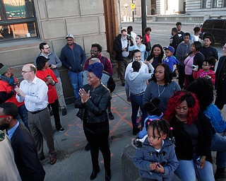 Youngstown residents gather at City Annex building the corner of Front St. and Market St. before walking under the Market St. Bridge during the Youngstown Peace Walk and Bonfire in downtown Youngstown, Sunday, Feb. 19, 2017. ..(Nikos Frazier | The Vindicator)..